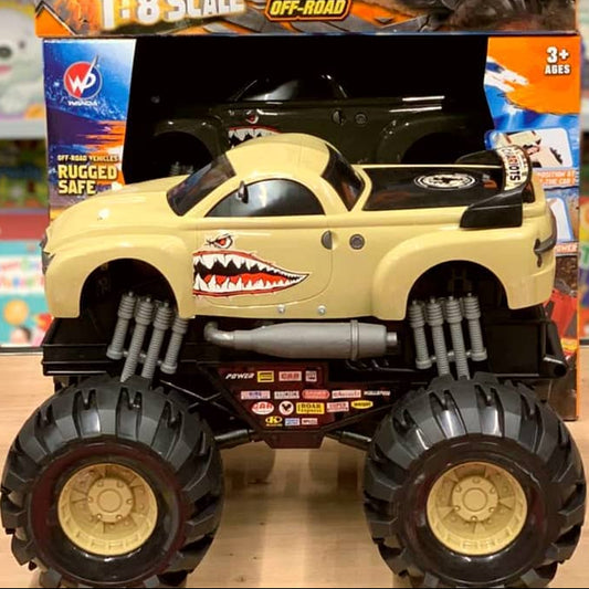 Toy truck packaging with monster truck design on a store shelf background