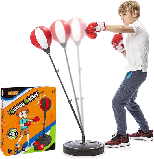 Child playing with a boxing set including a standing punching bag and gloves, with the packaging visible.